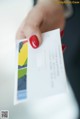 A person holding a welcome card in their hand.