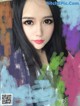 A woman with long black hair is posing for a picture.