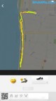 A map with a smiley face on the screen of a smartphone.